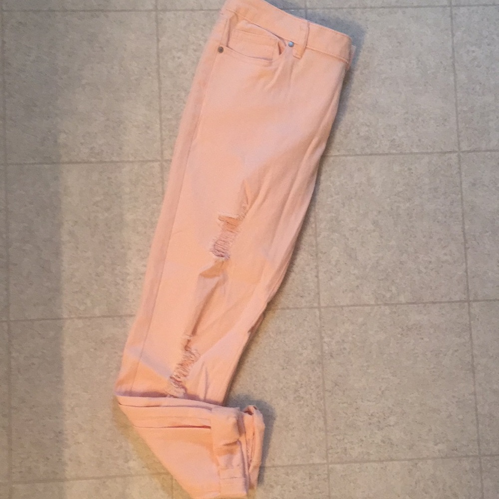 Blush pink distressed jeans